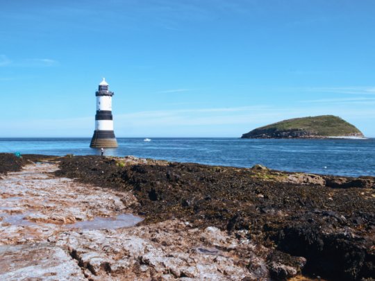 Penmon Point - Trwyn Du lighthouse and St Seiriol's Priory Banner