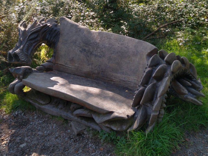 A beautifully carved dragon bench