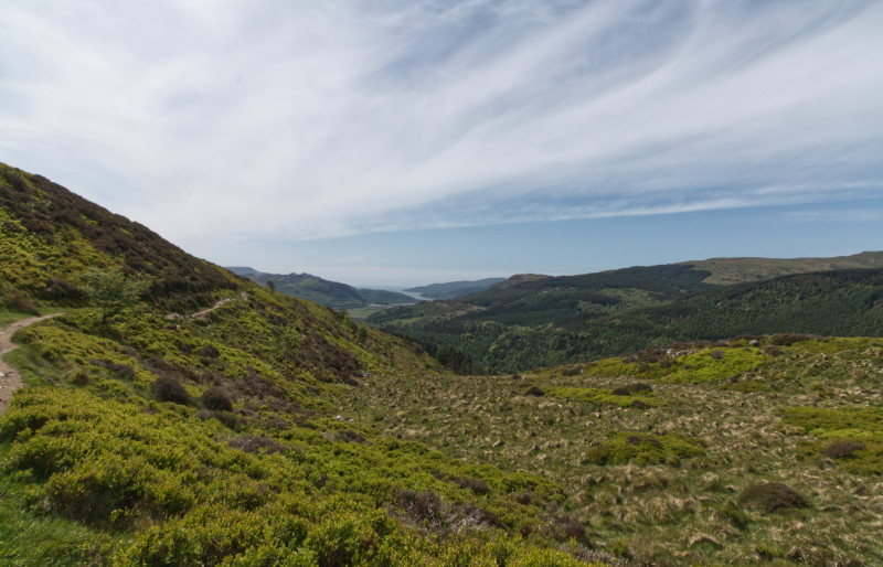 The path bounds over the hillside towards the ocean