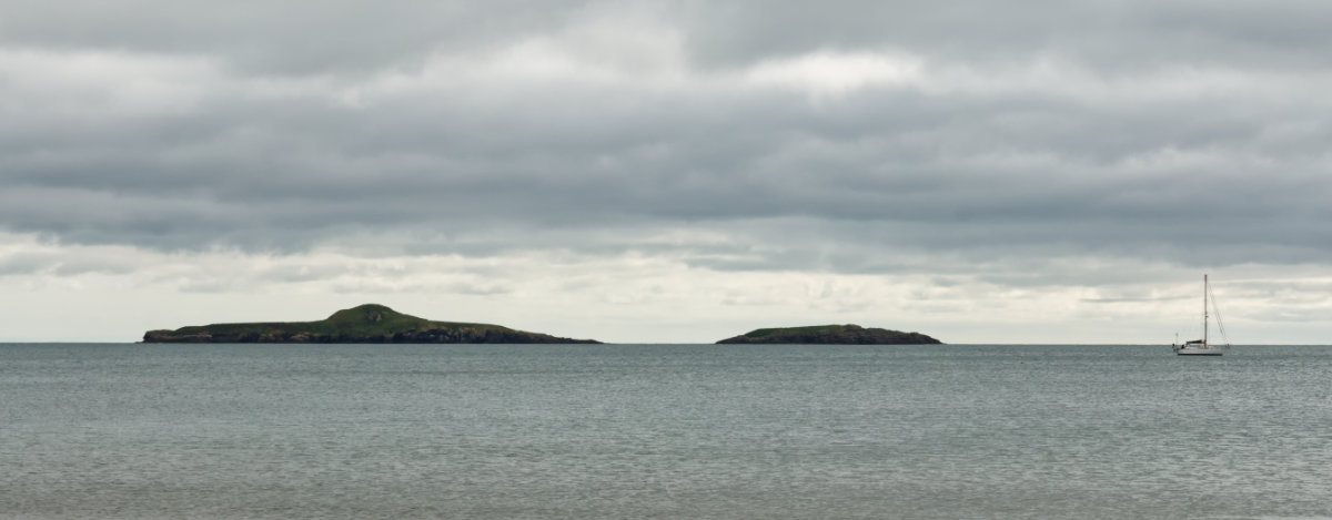 The two rocks out to sea and a sailboat